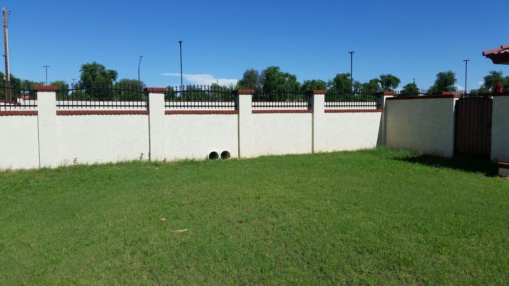 White Wall with Fence — Phoenix, AZ — Building Block Masonry