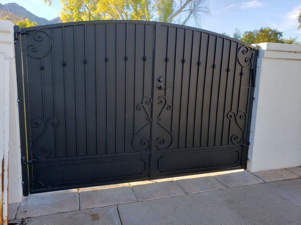 Black Gate with White Wall — Phoenix, AZ — Building Block Masonry