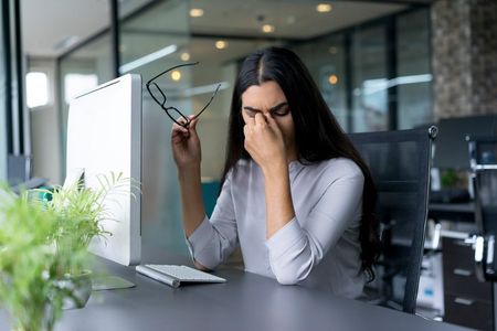 Workers Compensation — Man with Glasses Having Eyesight Problems in Milwaukee, WI