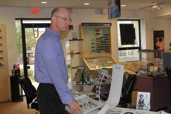 Men choosing eyeglasses — Eye Care Center In Brockton, Ma Men choosing eyeglasses — Eye Care Center In Brockton, Ma