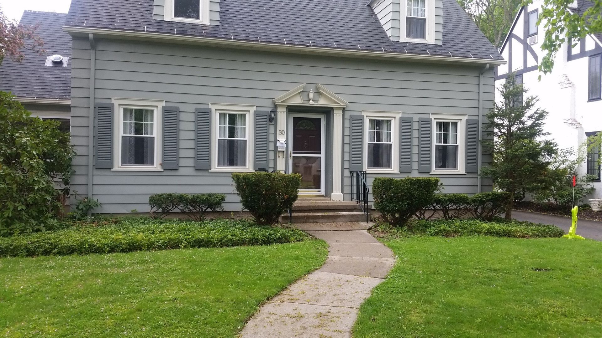 front of gray house without landscaping