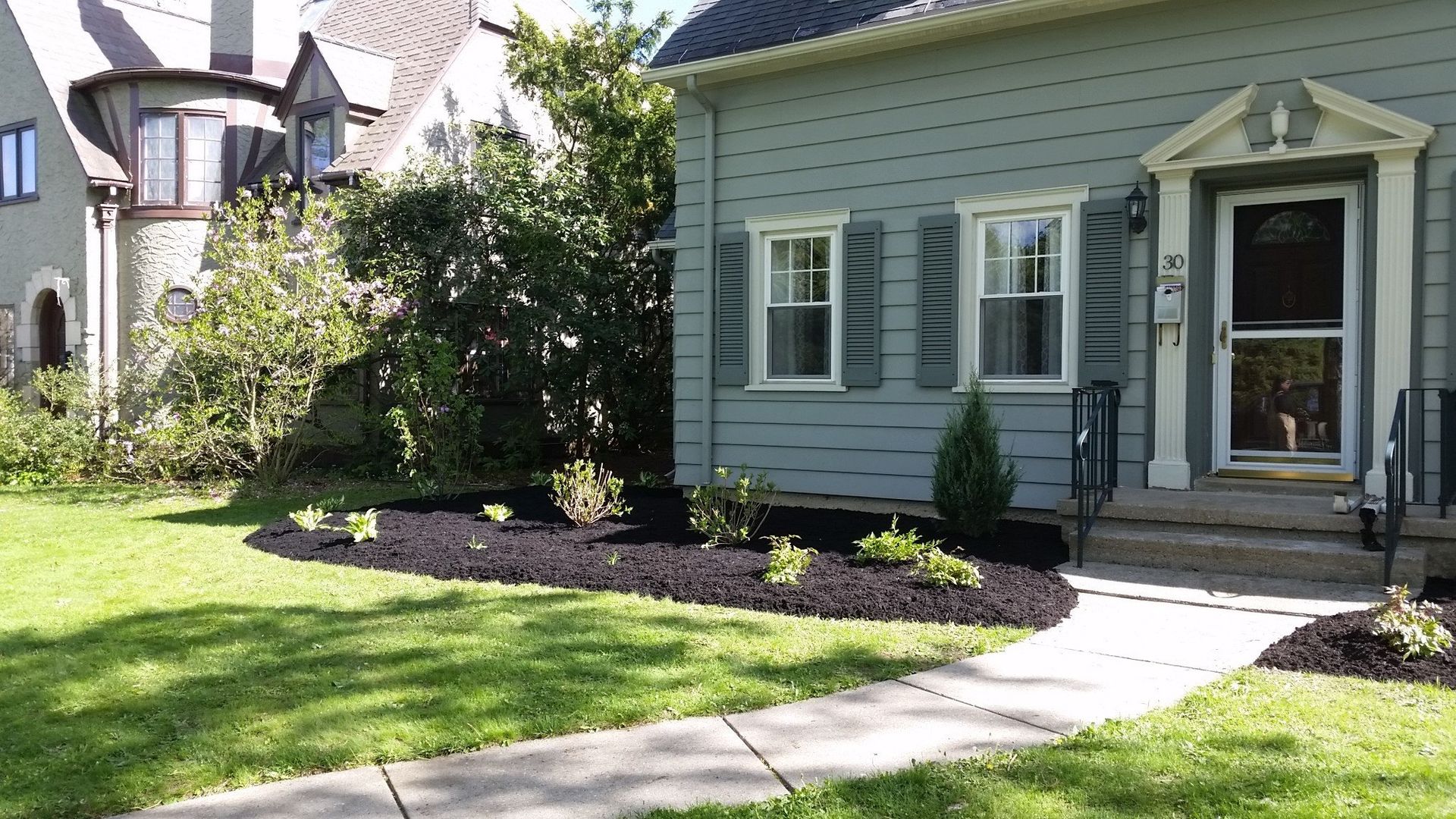 front left of gray house with landscaping