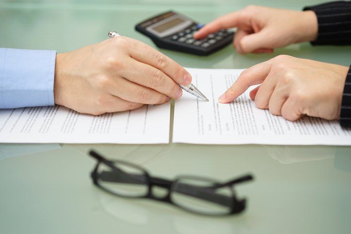 Lawyer checking documents — Business Law in Augusta, ME Lawyer checking documents — Business Law in Augusta, ME