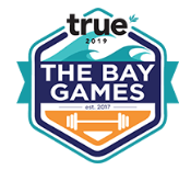The logo for the bay games is a badge with a barbell on it.