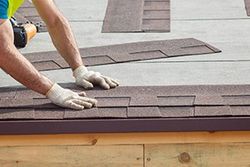 Roofing Company — Worker Installing Shingles in Tampa, FL