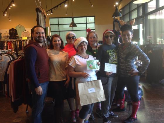 A group of people posing for a picture in a store