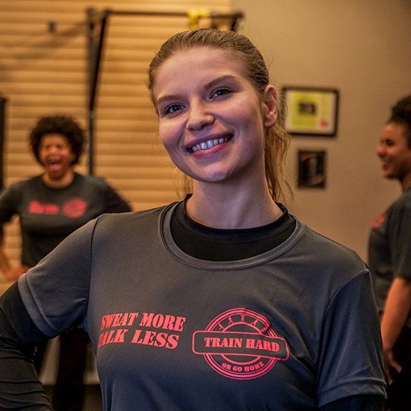 A woman wearing a shirt that says