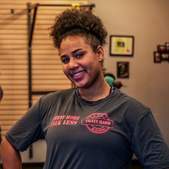 A woman wearing a t-shirt that says heat more talk less