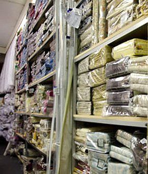  A shelf stacked with new fabrics