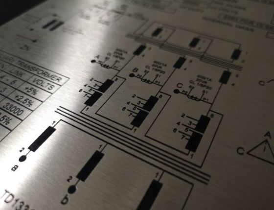 Deep etched metal sign