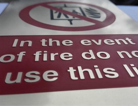 Deep etched metal sign