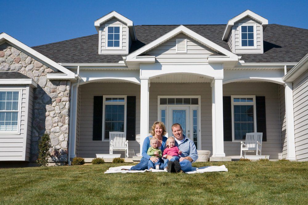 Happy Family With Their New House — Dallas, TX — Dynamic Customize Tax