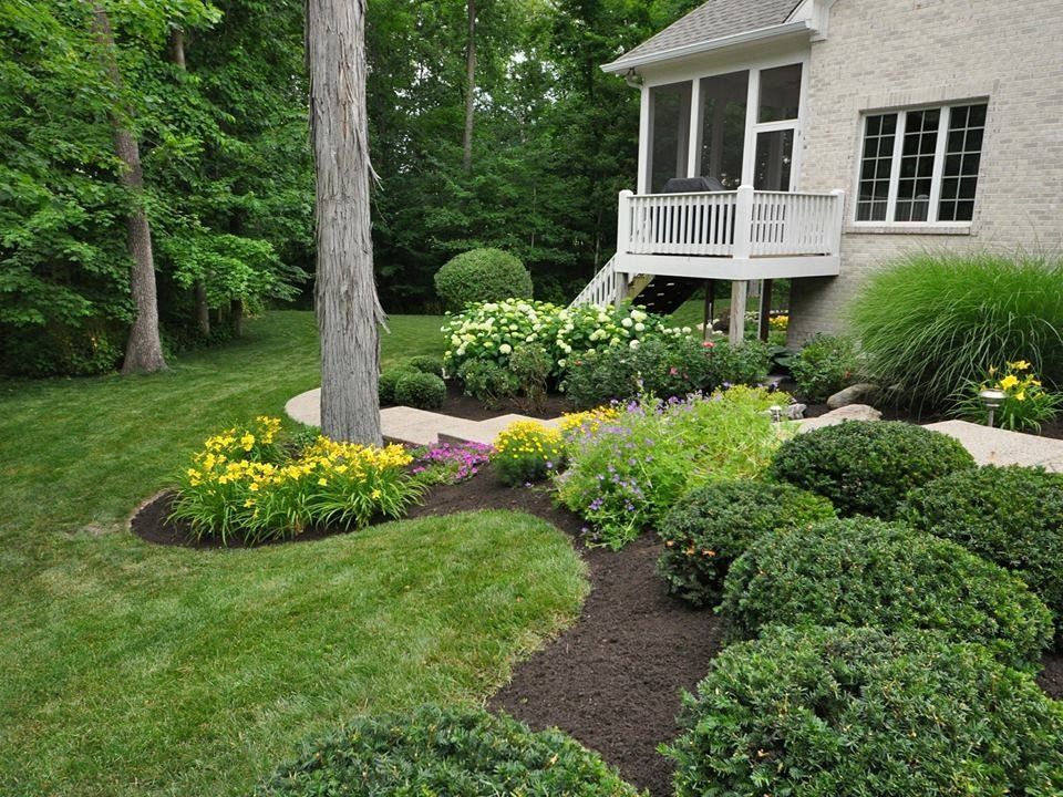 Flower Bed Brink — Green Grasses with Beautiful Design in Brunswick, GA