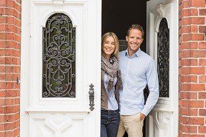 Happy Couple Inside a House — Insurance Services in Palm City, FL