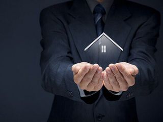 Businessman with a Digital House in Hands — Insurance Services Palm City FL Businessman with a Digital House in Hands — Insurance Services Palm City FL