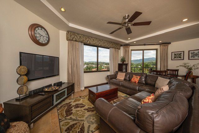 A living room with a couch and a flat screen tv