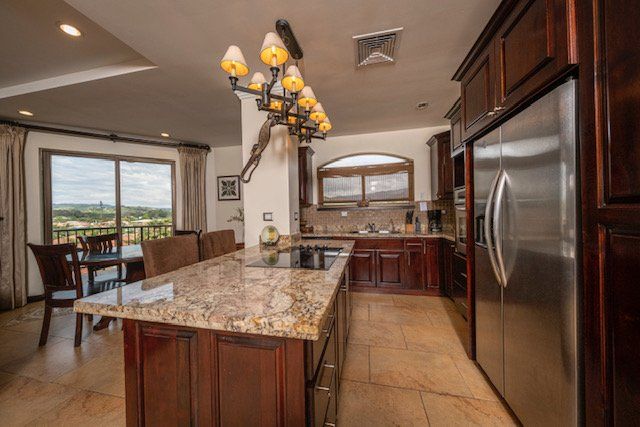 A kitchen with stainless steel appliances and granite counter tops