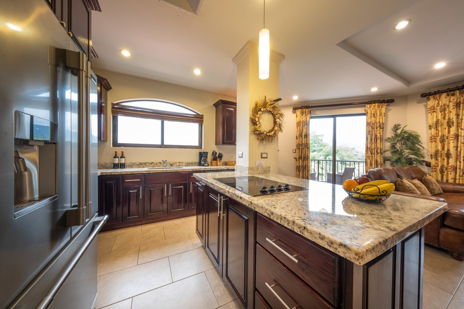 A kitchen with stainless steel appliances and granite counter tops
