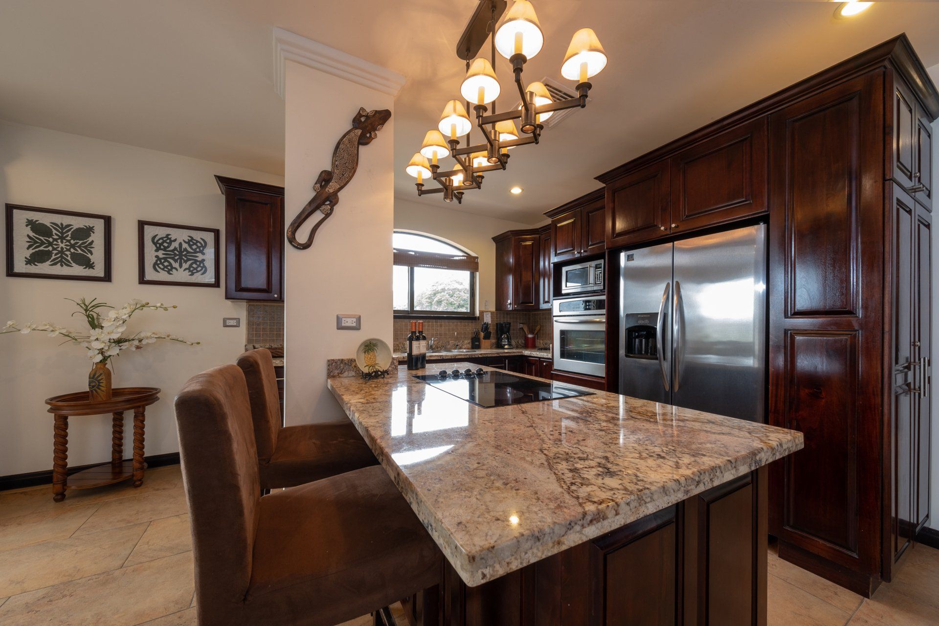 A kitchen with granite counter tops and stainless steel appliances