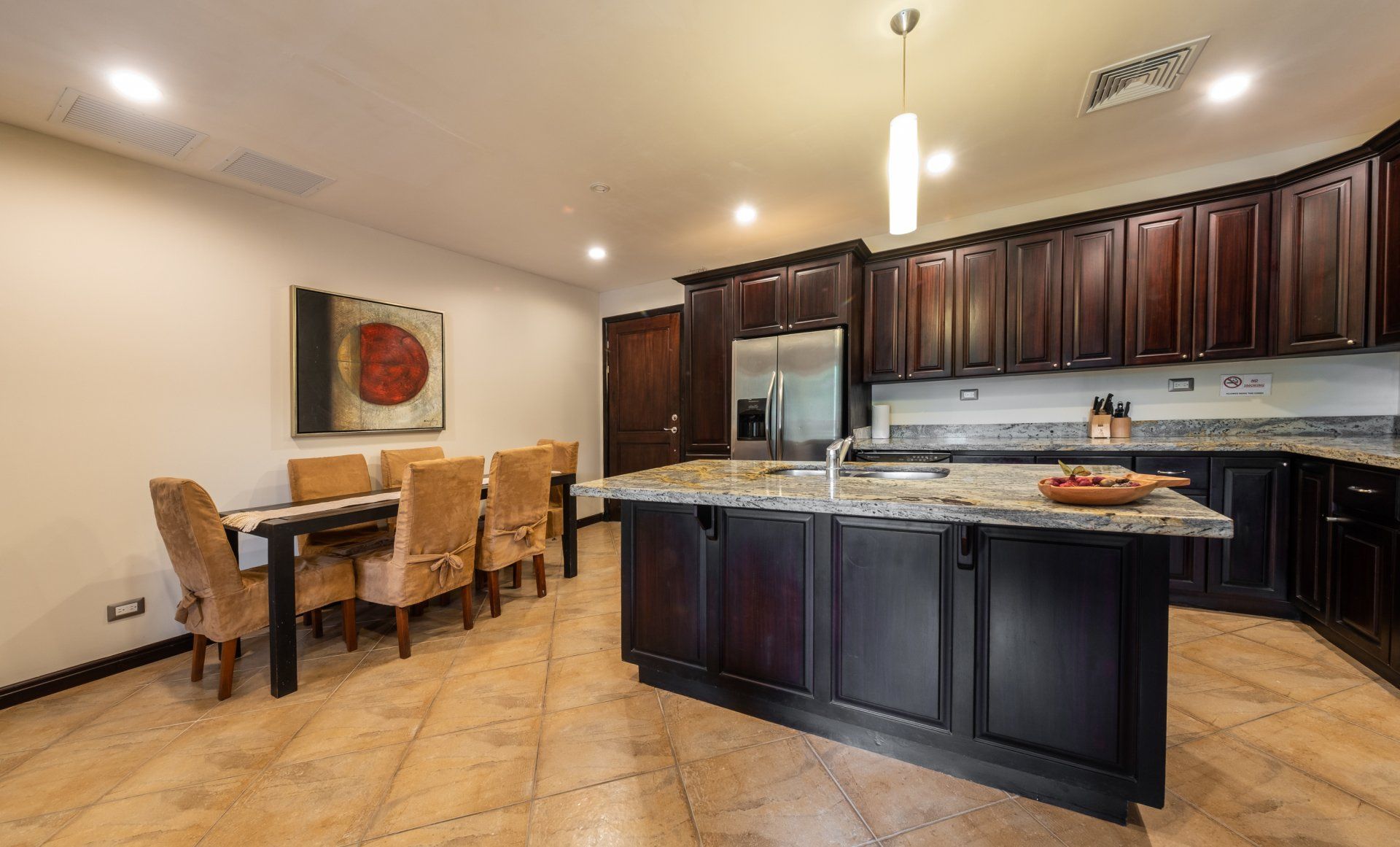 There is a large island in the middle of the kitchen.