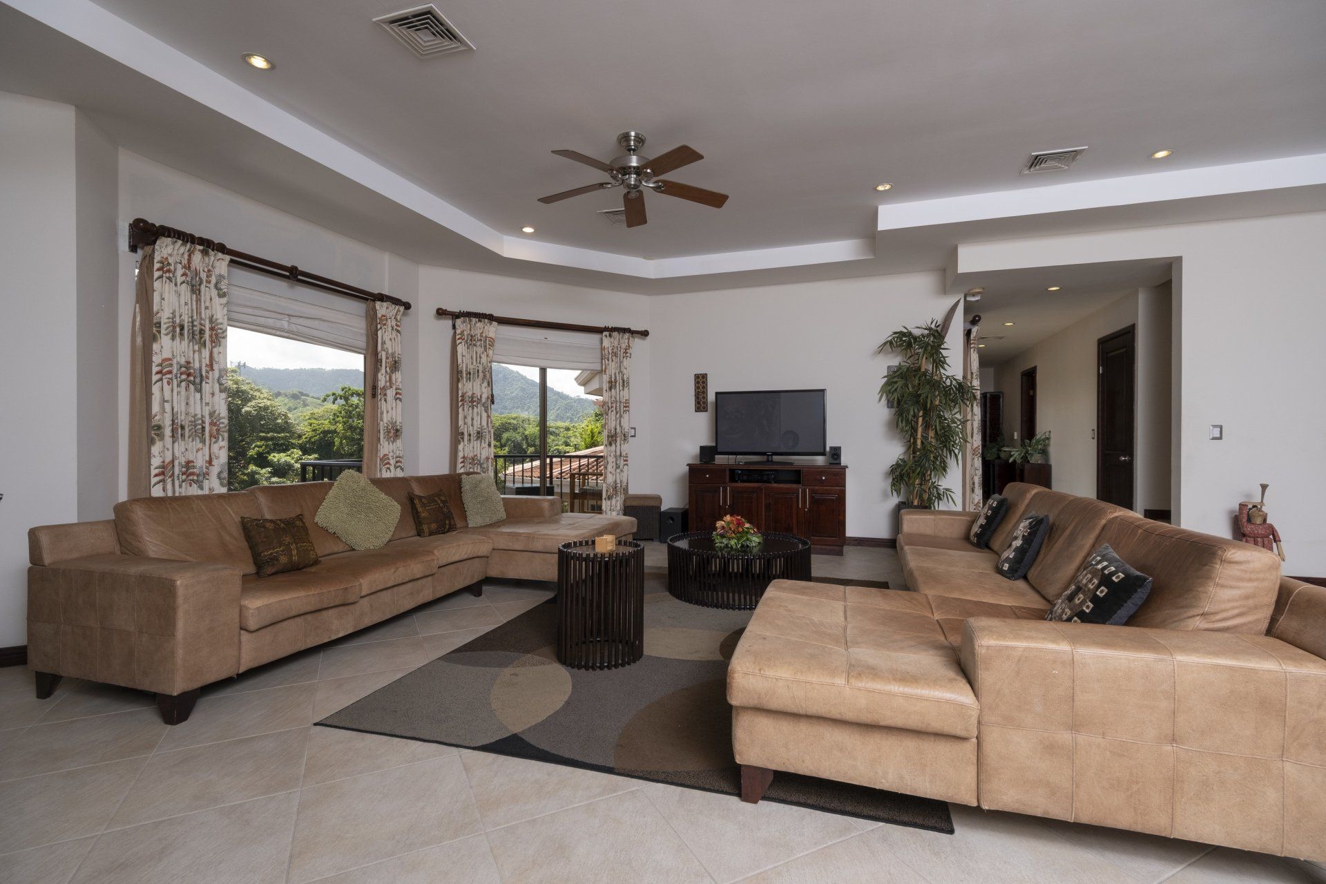 A living room filled with furniture and a flat screen tv