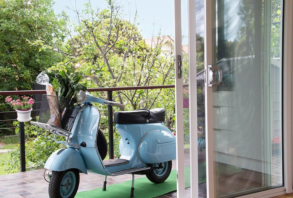 Motorbike Outside The House — Glass & Aluminium Windows & Doors In Yeppoon, QLD