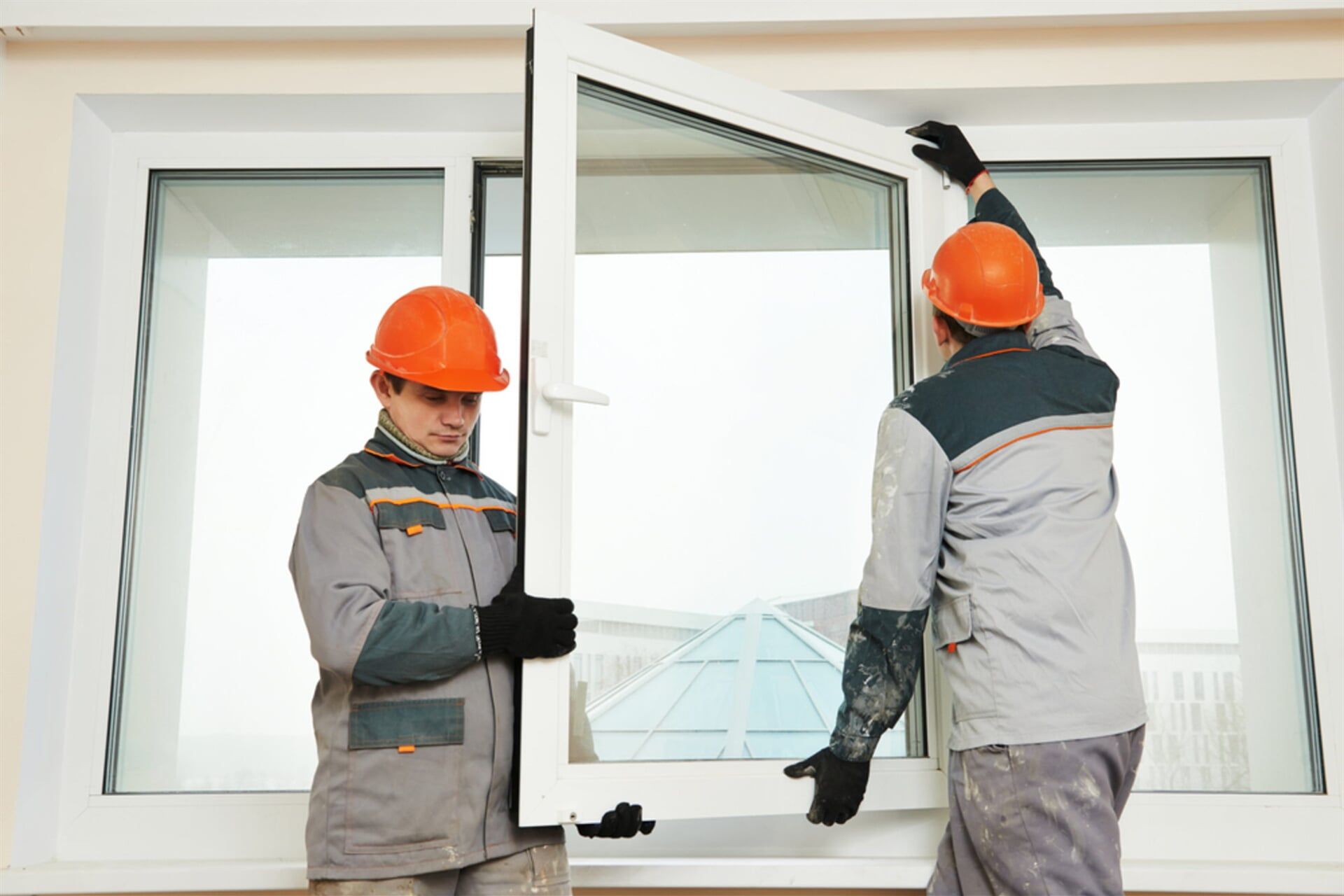 Workers Installing New Window — Glass & Aluminium Windows & Doors In Yeppoon, QLD