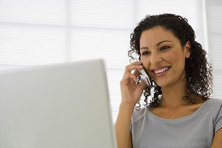 Woman Calling and using laptop — in Tampa,, FL Woman Calling and using laptop — in Tampa,, FL