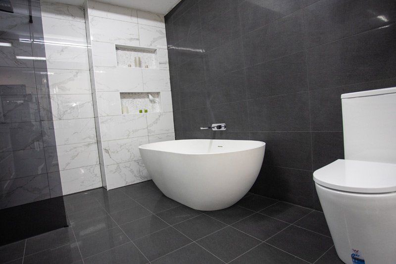 tub and toilet in bathroom