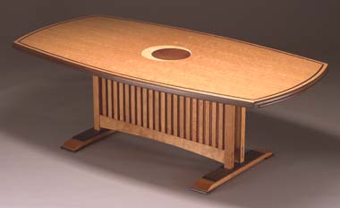 Dining room table in figured cherry with wenge accents, center marquetry in amboyna burl and quilted maple