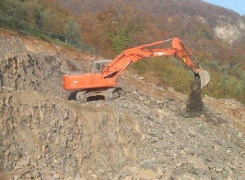 1 scavatrice arancione