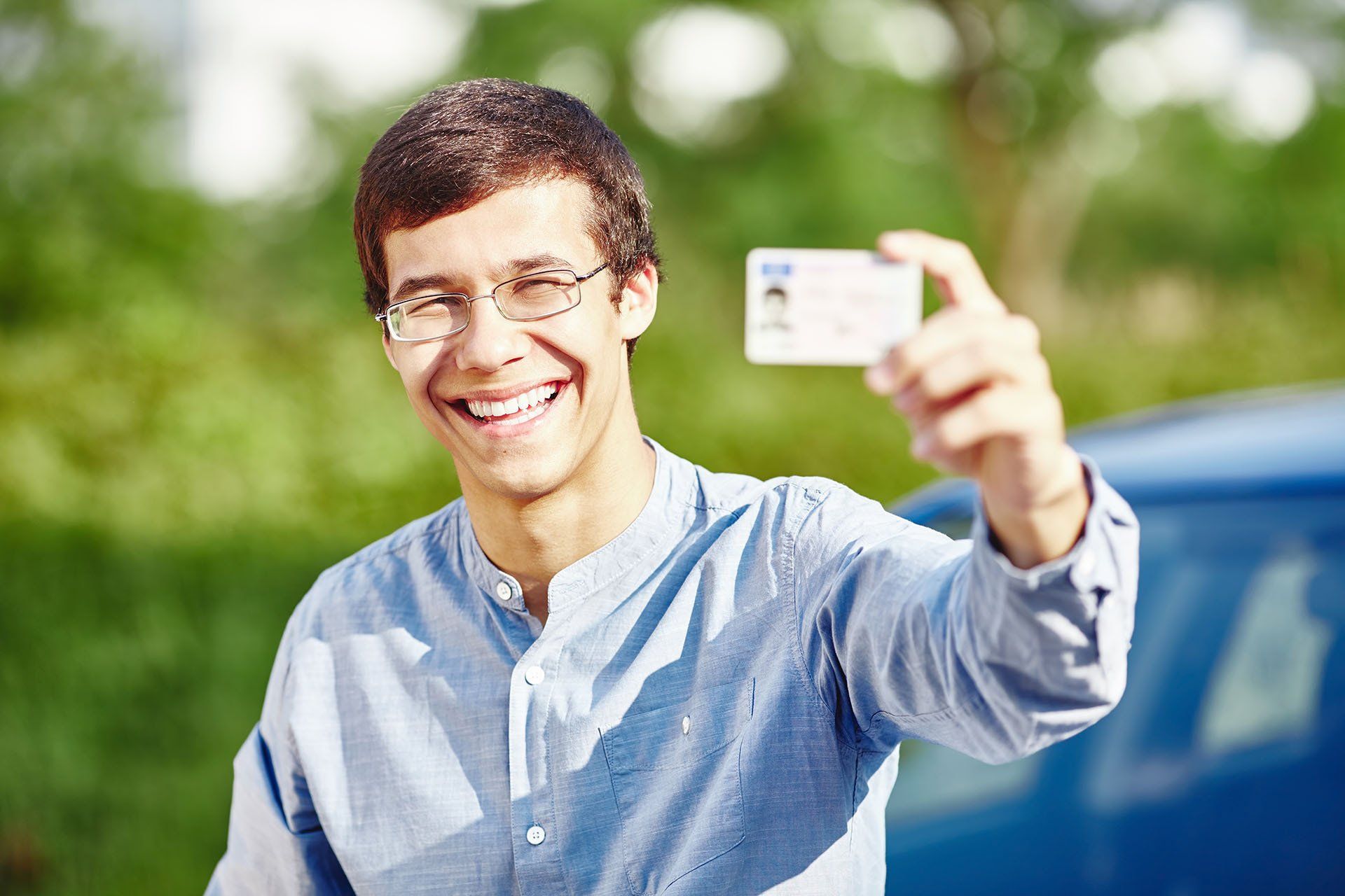 Man Holding Driving License — Houston, TX — Driving School of Houston