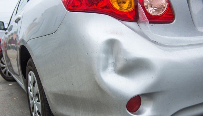 Dent Removal — Gray Car With Bump in Sandy, UT Dent Removal — Gray Car With Bump in Sandy, UT