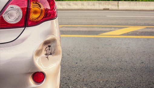 Collision Repair Salt Lake City — Car With Bump in Sandy, UT Collision Repair Salt Lake City — Car With Bump in Sandy, UT