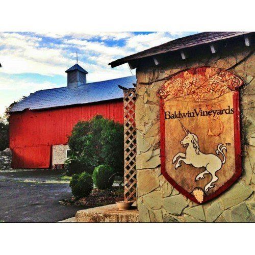 A sign for baldwin vineyards with a unicorn on it