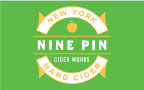 The logo for new york nine pin cider works hard cider