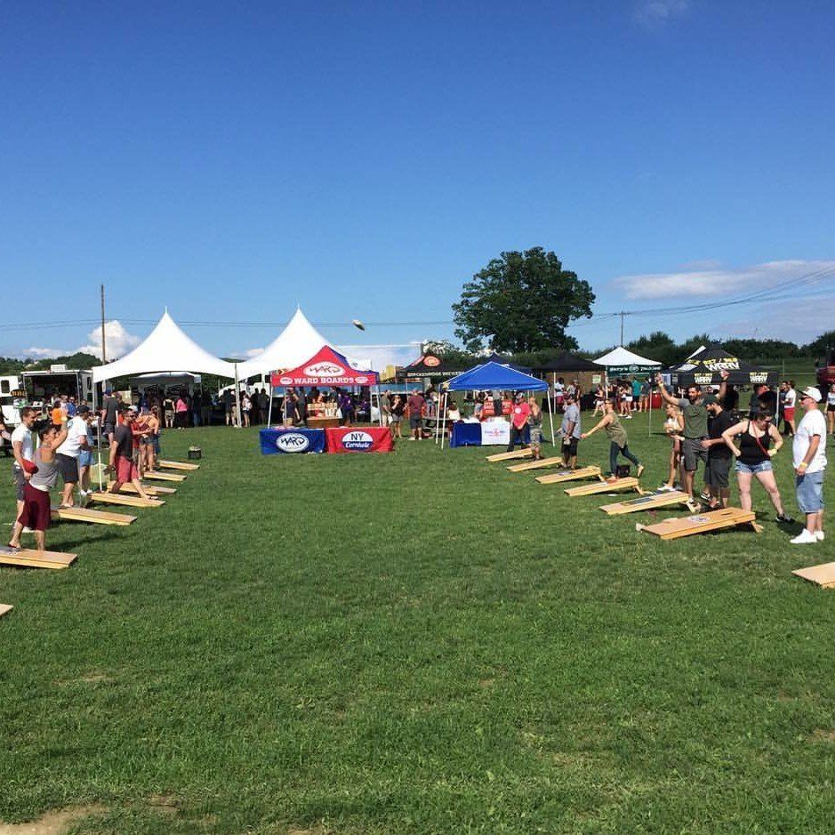 A group of people are playing a game in a field.