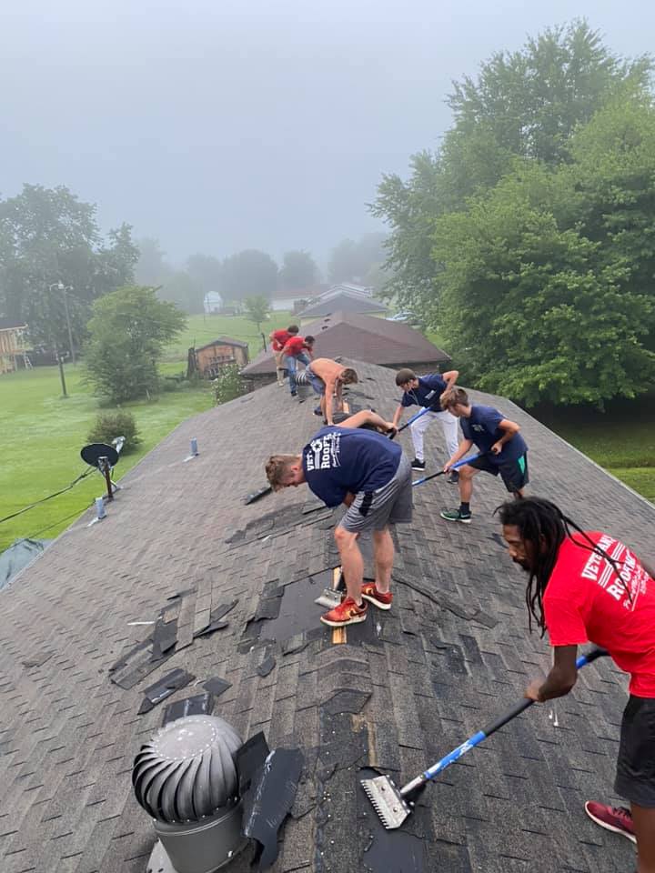 roofers scraping shingles