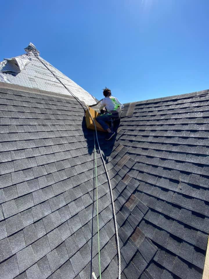 roofer installing shingles