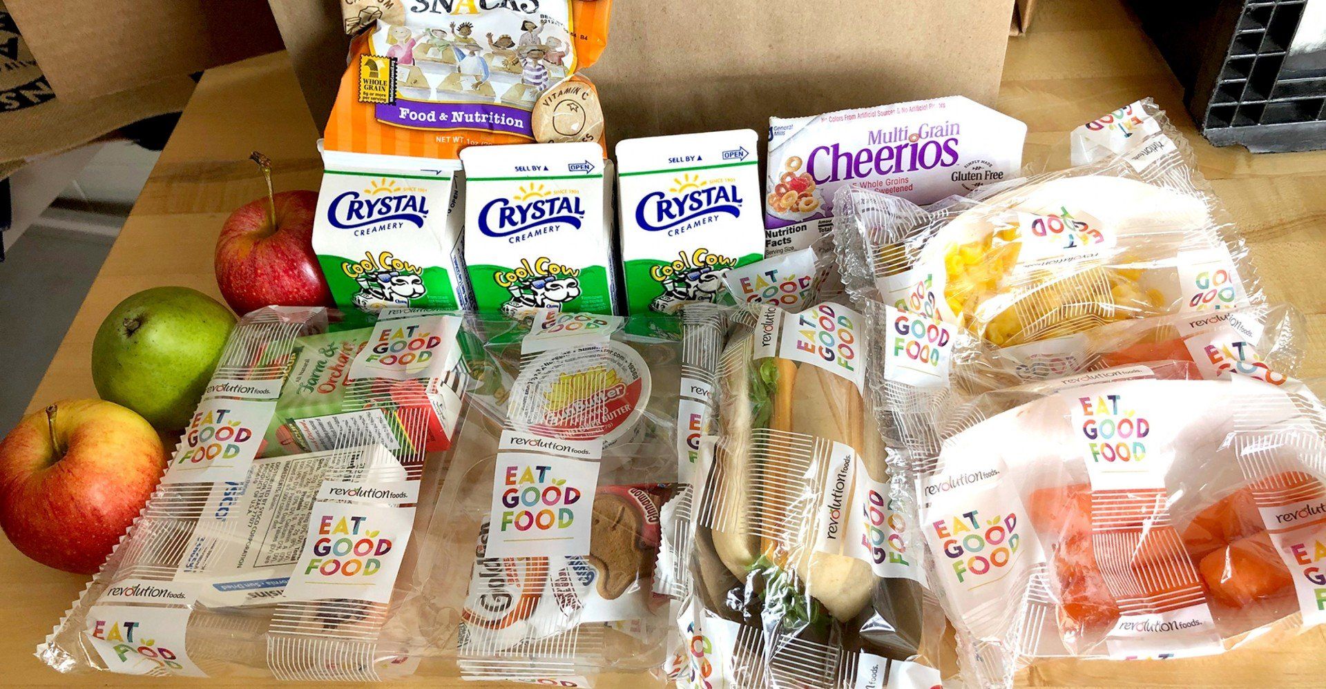 A table topped with a variety of food including cheerios