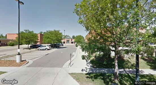 A google street view of a parking lot and a building