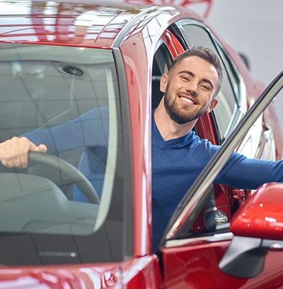 Man in Red Car — Newton, MA — Bikofsky Insurance Agency Inc