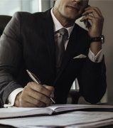 Professional Bond Agent — Attorney Talking on Phone and Writing in Abingdon, VA Professional Bond Agent — Attorney Talking on Phone and Writing in Abingdon, VA