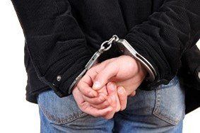 Man with Handcuffs - Affordable Bail Bonds