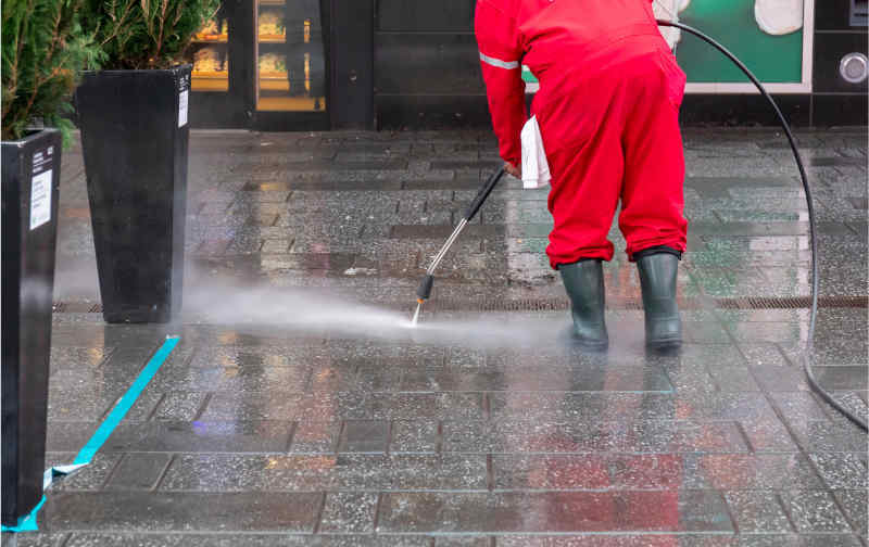 Power washing places of business A professional power washing a commercial outdoor space