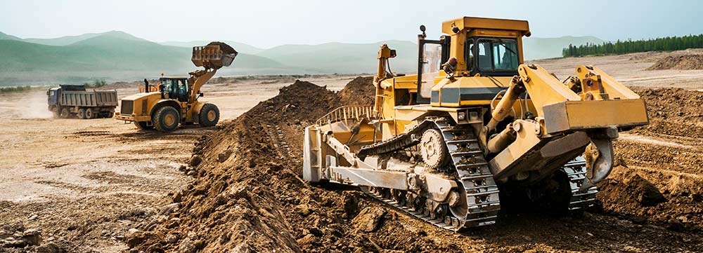 earthmoving equipment on excavation site