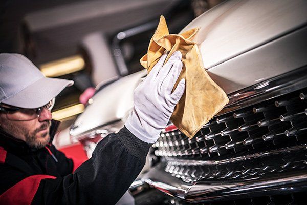 A mechanic working on an auto cooling repair in Adelaide
