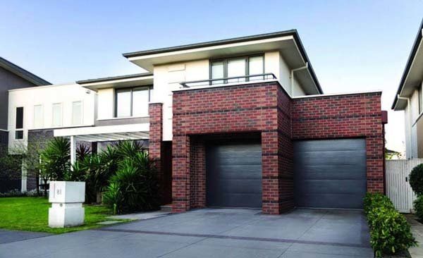 brick house with panelift garage doors