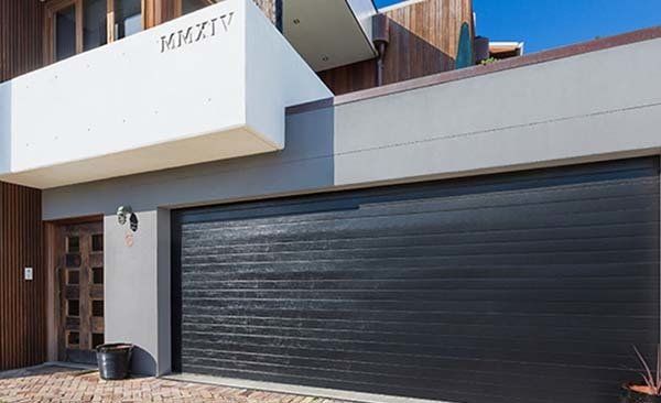 black garage door on modern building