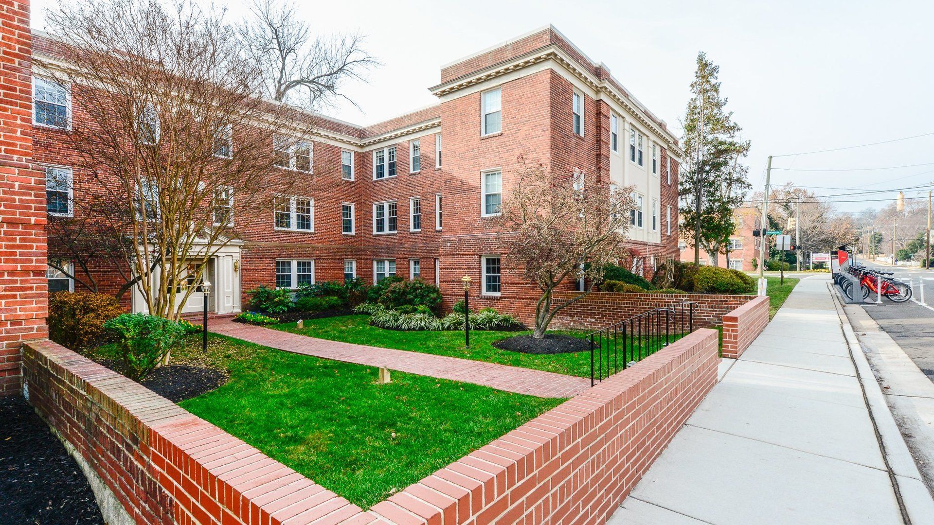 Love the Red Brick & Green Lush Landscaping!